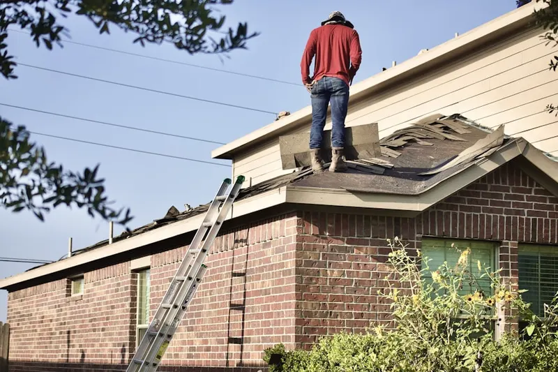 Professional roofer working on a residential roof in Cedarwood Cove